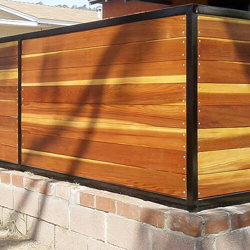 Redwood front yard fence with metal trim